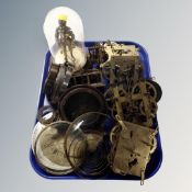 A tray of assorted clock movements and parts, figure of a knight under dome.