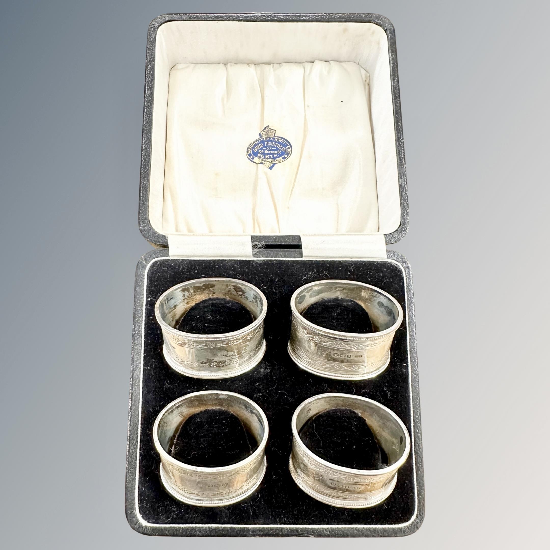 A boxed set of four silver napkin rings, Birmingham marks. CONDITION REPORT: 79.