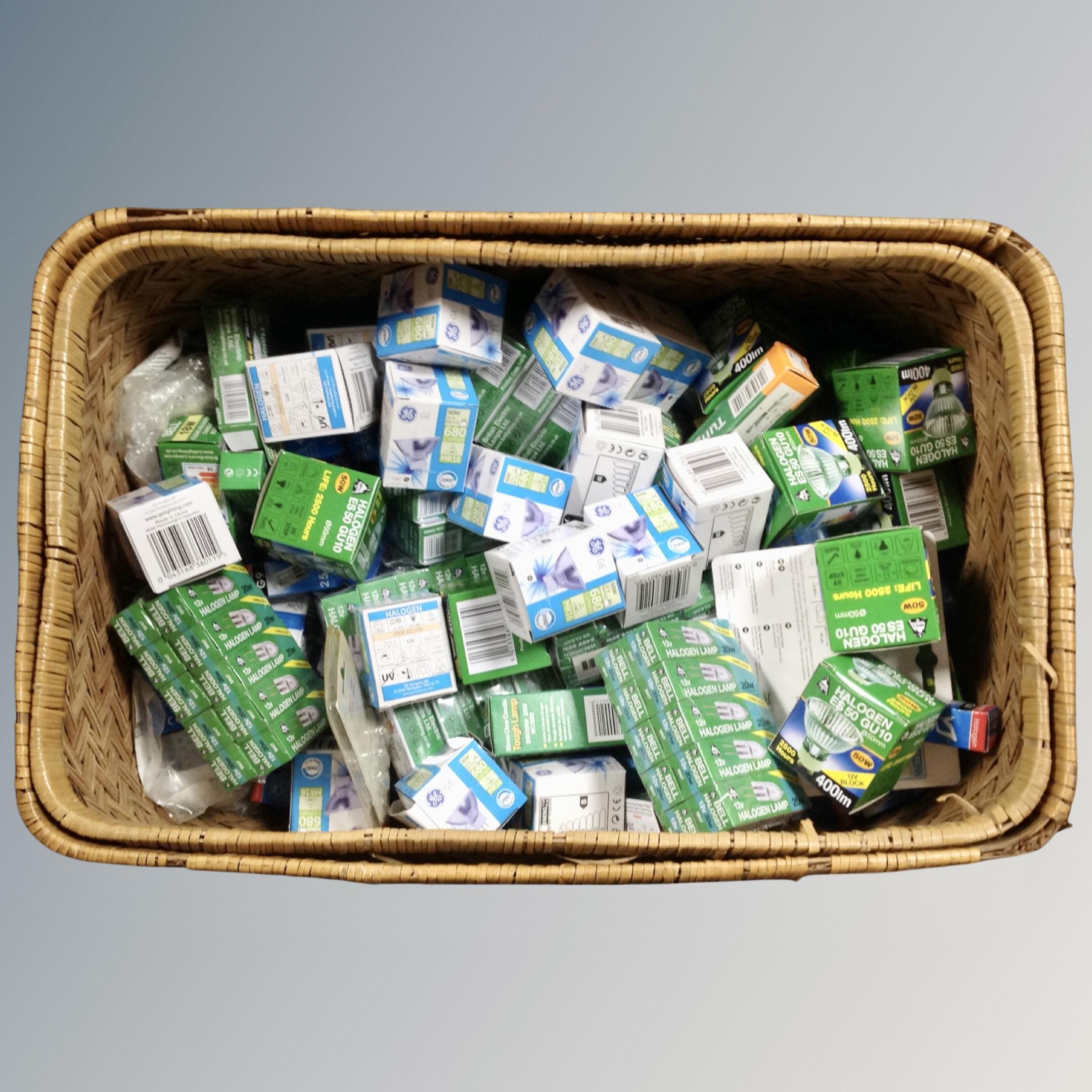 Two graduated wicker baskets containing a quantity of halogen bulbs