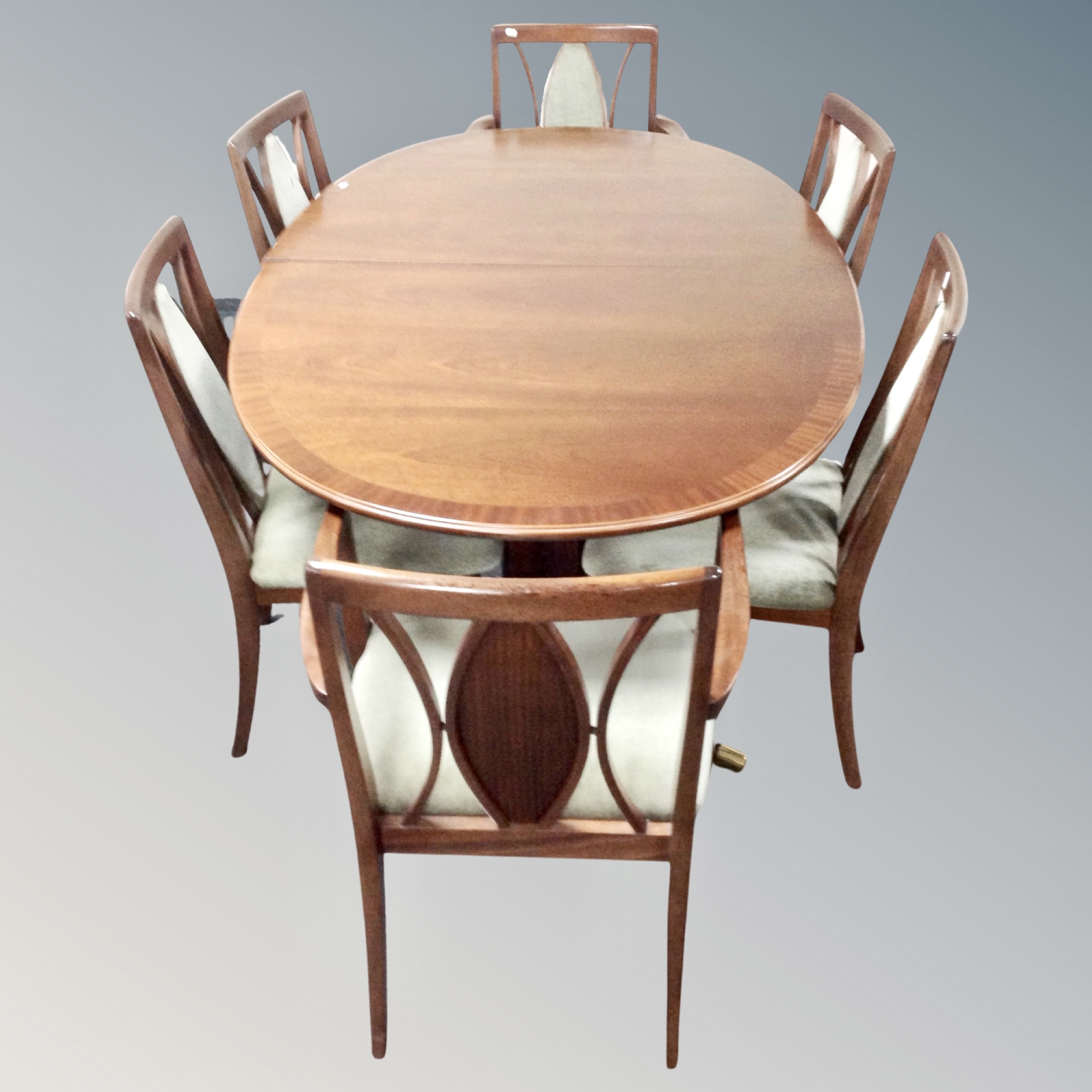 A 20th century oval G-plan dining table and six chairs