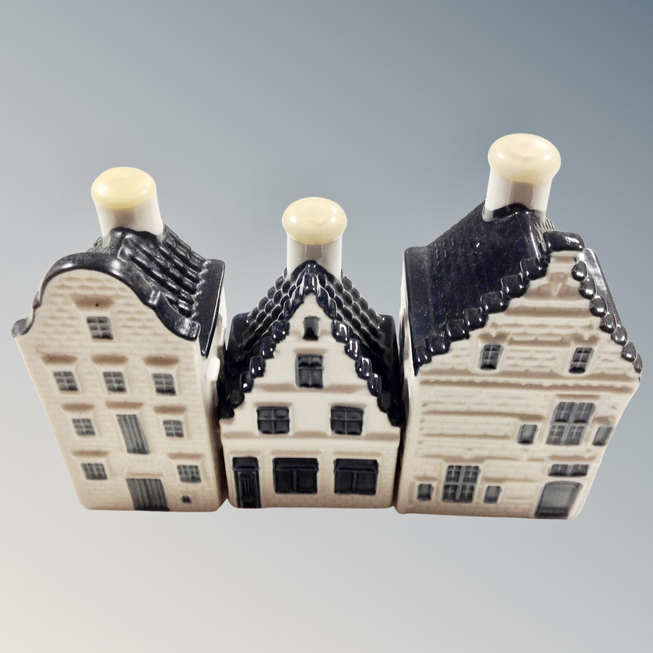 Three blue Delft KLM Bols house miniatures, 73, 79 and 82.