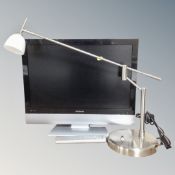 A Polaroid 22 inch LCD TV with remote together with angle poise table lamp