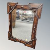 An Edwardian oak beaded framed mirror