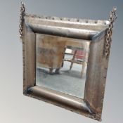 A contemporary metal framed wall mirror
