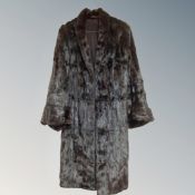 A 3/4 length dark brown fur coat