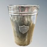 A horn beaker with silver mounts, height 10cm.