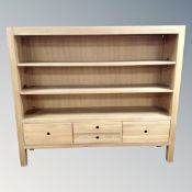 A contemporary oak three tier open shelving unit fitted with four drawers 140 cm x 163 cm x 40 cm