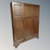 A 19th century oak triple door cloakroom cabinet