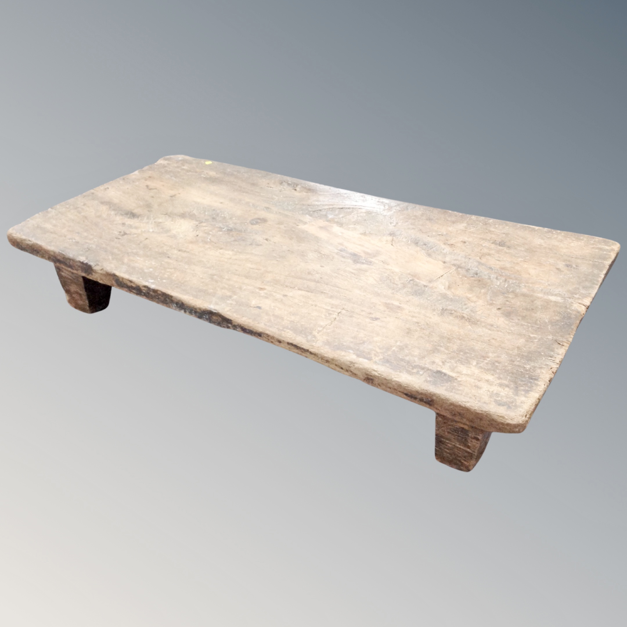 A rustic refectory coffee table
