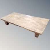 A rustic refectory coffee table