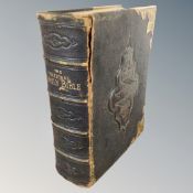 A 19th century leather and brass bound Holy bible with colour illustration book plates