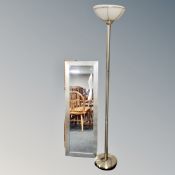 A contemporary uplighter together with a framed bevelled hall mirror