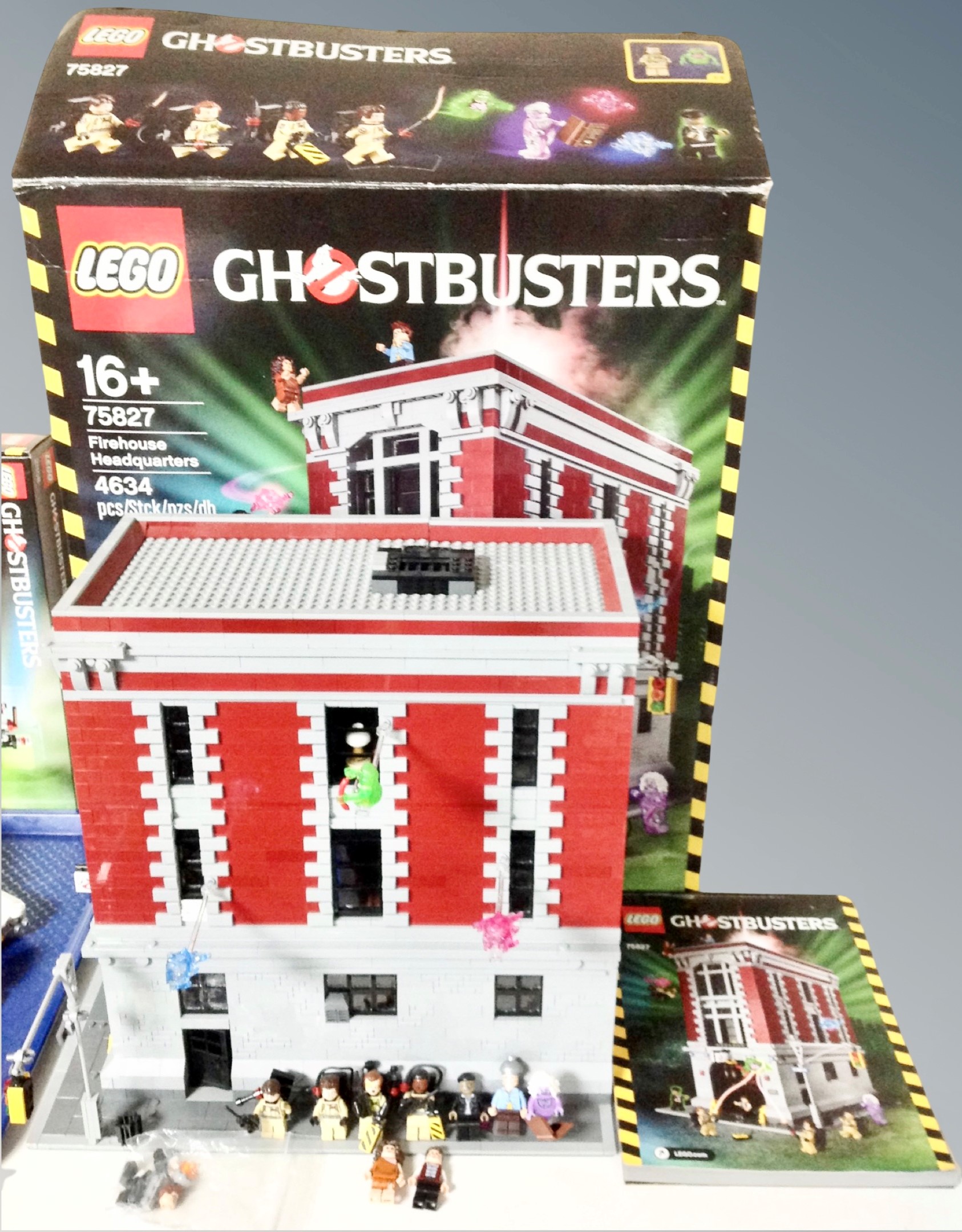 A Lego Ghostbusters 75827 Firehouse head quarters with box and instructions