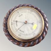 A carved vintage nautical barometer (af)