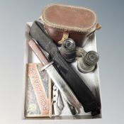 A hunting knife in sheath together with two further pocket knives,