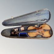 An early 20th century German violin labelled Copy of Antonio Stradivarius, two-piece 14" back,