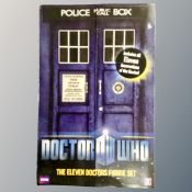 A Dr Who eleven doctors action figures set in Tardis box