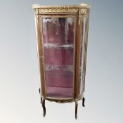 A Louis XV style vitrine with gilt metal mounts and marble top (glass cracked)