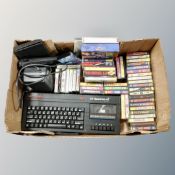 A box of Sinclair 128 ZX Spectrum Plus with adaptor and approximately 50 games