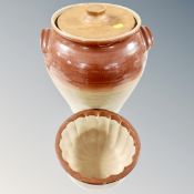 A 19th century glazed stoneware lidded crock pot together with stoneware jelly mould