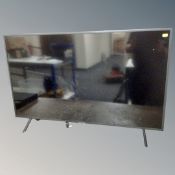 A Samsung 43 inch LCD Smart TV with remote