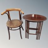 A nest of three antique mahogany tables together with a bentwood armchair