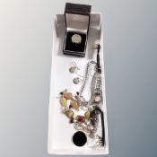 A box of costume jewellery, cocktail watch, polished stone necklace, dress rings,
