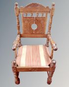 A 19th century carved oak chair.