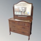 An Edwardian oak four drawer dressing chest together with three drawer matching chest