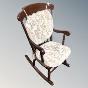 A stained beech child's rocking chair