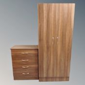 A contemporary double door wardrobe with matching four drawer chest in oak finish