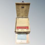 A mid century Ekco portable radio with original instructions