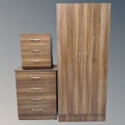 A four piece contemporary bedroom suite comprising of double door wardrobe, four drawer chest,