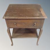 A 19th century two tier side table fitted a drawer