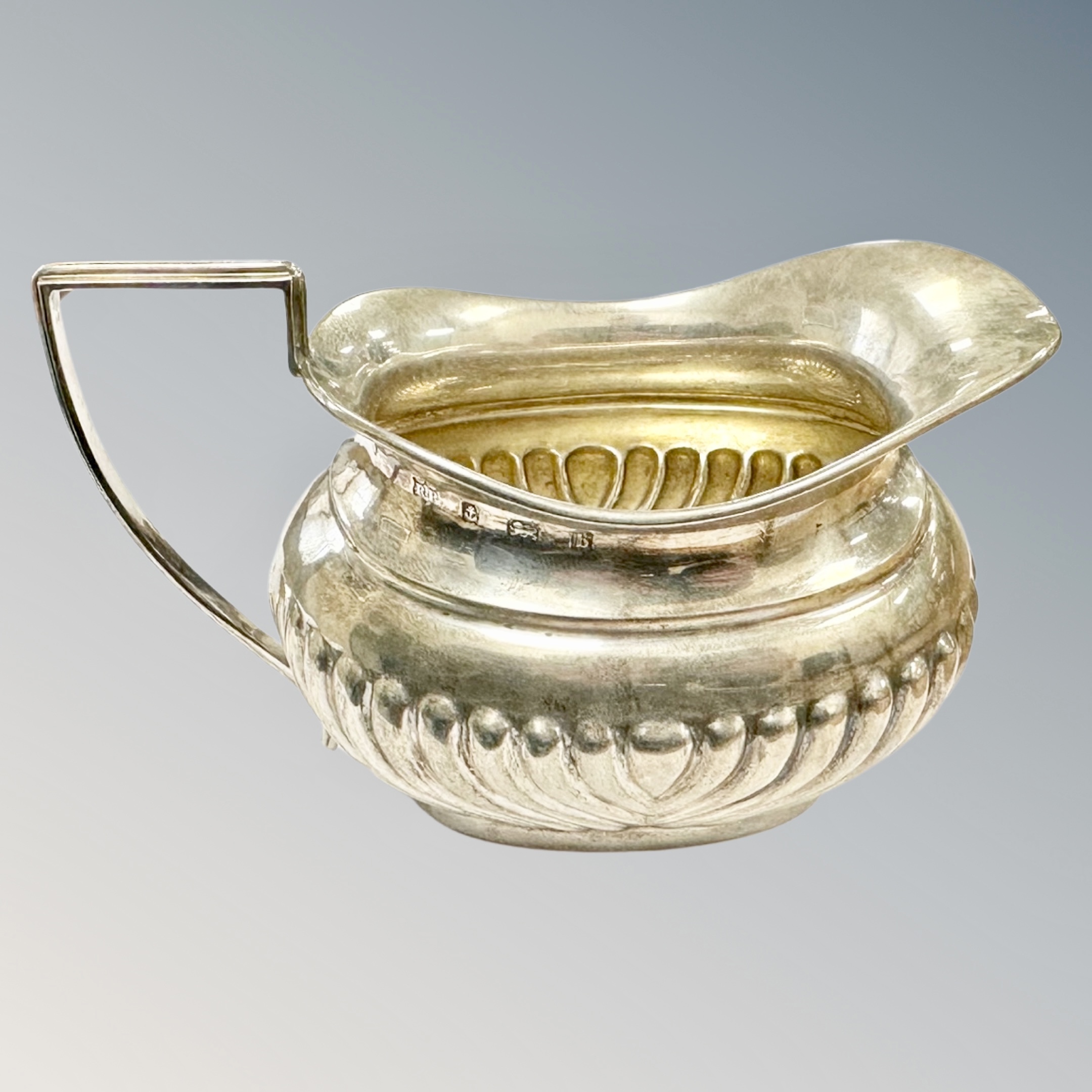 A silver cream jug, Birmingham marks, length 11.5cm.