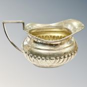 A silver cream jug, Birmingham marks, length 11.5cm.