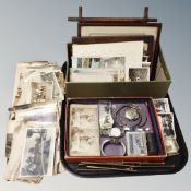 A tray of antique and later monochrome pictures and postcards, stereoscope cards, costume jewellery,