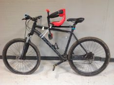 A Carerra Gent's front suspension mountain bike with child's seat