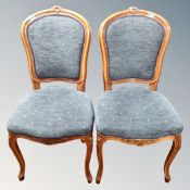 A pair of contemporary French style dining chairs in blue fabric