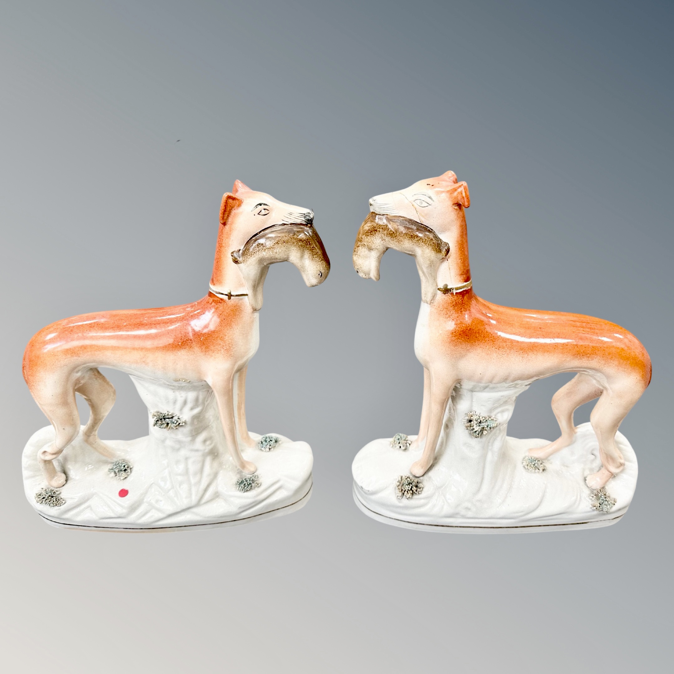 A pair of 19th century Staffordshire greyhound,