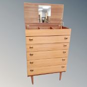 A mid century five drawer bachelor's chest