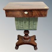 A 19th century mahogany work table on pedestal paw feet (as found)