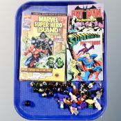 A tray of Lego miniature figures, Batman, glass Pokemon marbles,