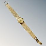 A 9ct gold Tissot lady's wristwatch on 9ct gold integral bracelet CONDITION REPORT: