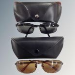 Two pairs of Rayban sunglasses in cases