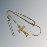 A 9ct gold band ring and similar crucifix on chain CONDITION REPORT: 6.