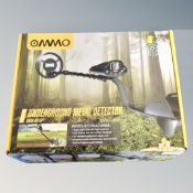 An Ommo underground metal detector, boxed.