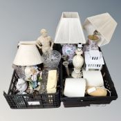 Two crates of glazed table lamps with shades, alabaster table lamp, figurines,