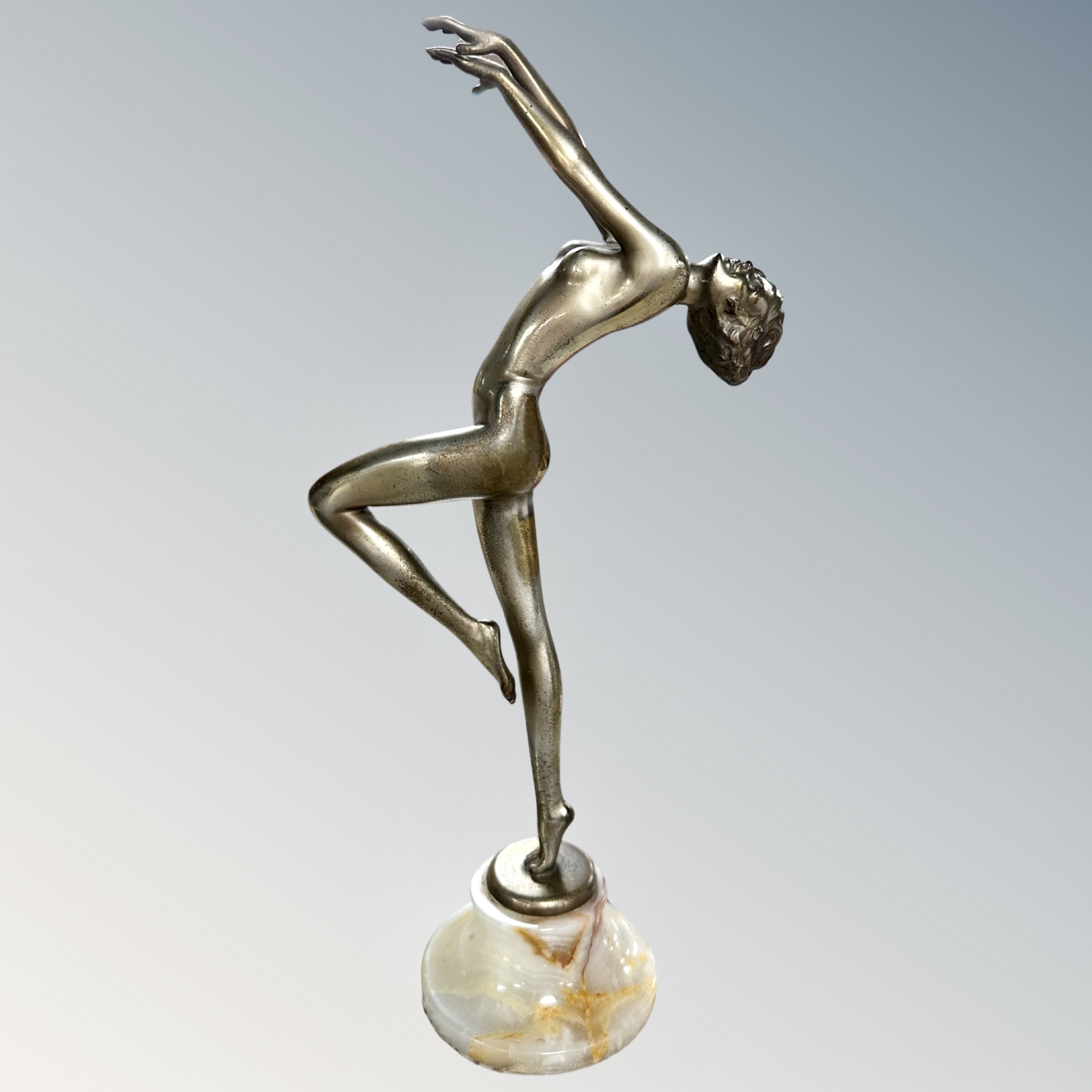 After Josef Lorenzl, an Art Deco silver-bronze of 'Vivian', standing nude on a turned onyx socle,