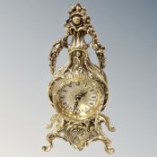 An ornate brass French style mantel clock